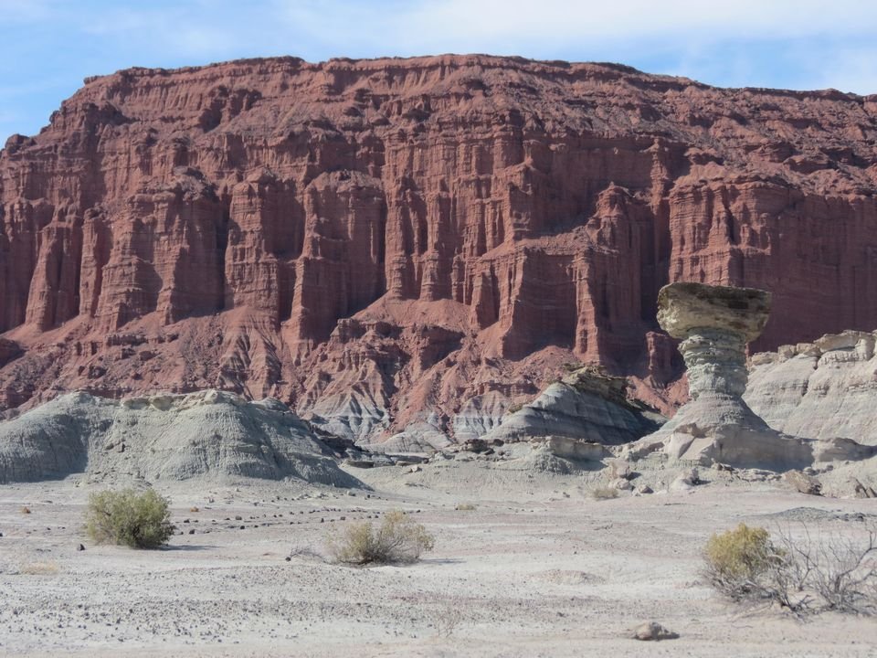 El Hongo rock formation and the red cliffs of Ischigualasto Provincial Park (Valle de la Luna), San Juan